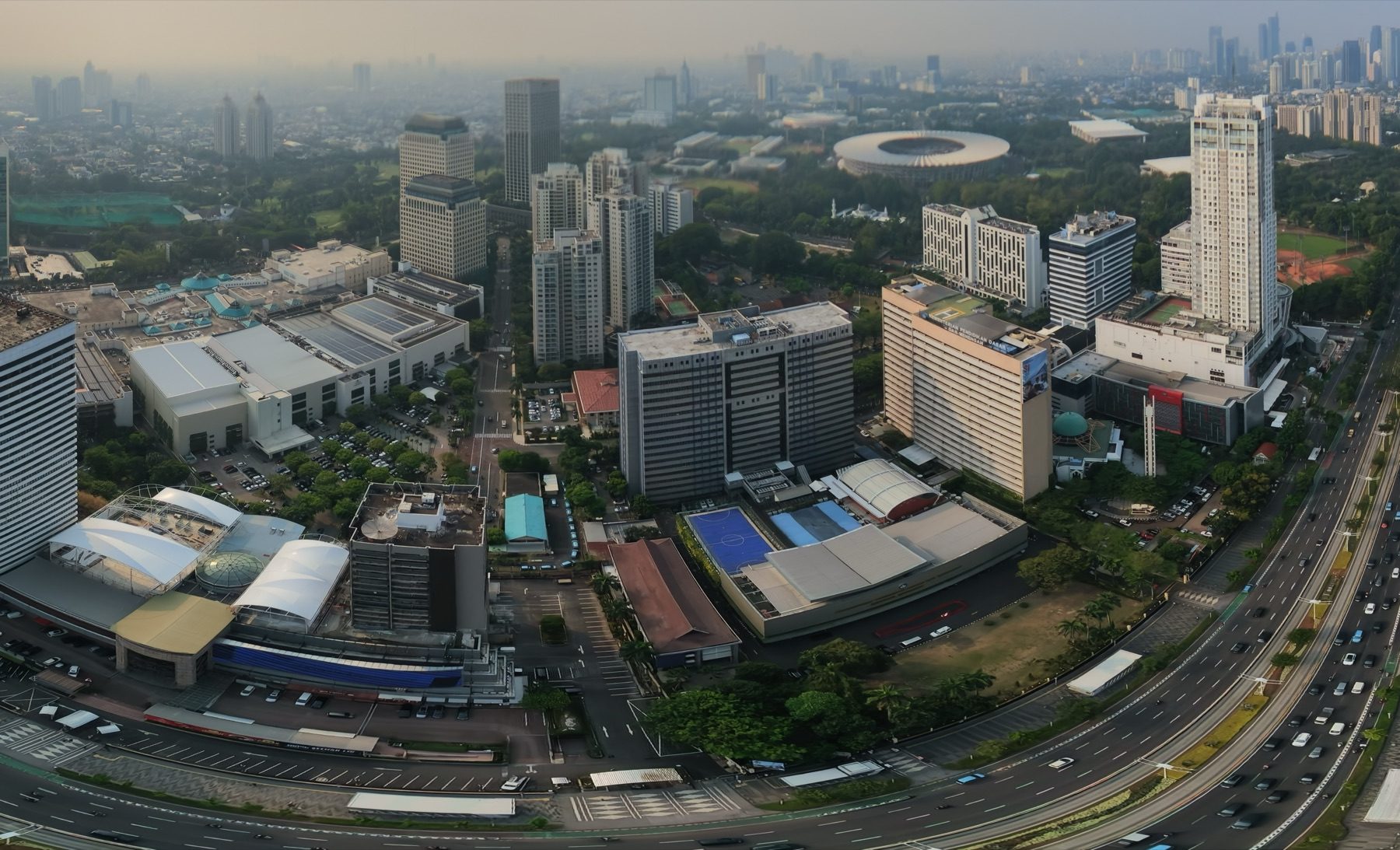 Senayan from above: Plaza Senayan, the towers along Sudirman and the round roof of Gelora Bung Karno